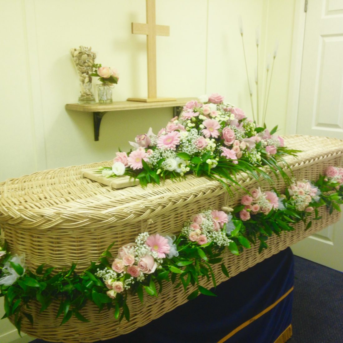 Willow Coffin with Flower Garland Lodge Brothers Funeral Directors