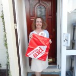 Carol Disspain of Lodge Brothers Molesey Collects for Christian Aid